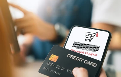 A shopper applying a coupon code to get a discount on an online purchase.