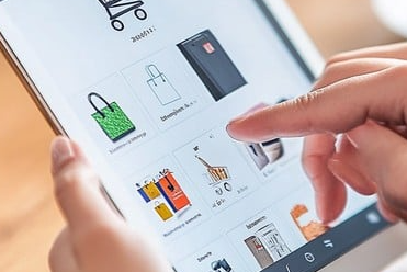 A close-up of a smartphone displaying various discount codes, representing how to unlock hidden coupons for your favorite brands through digital tools.