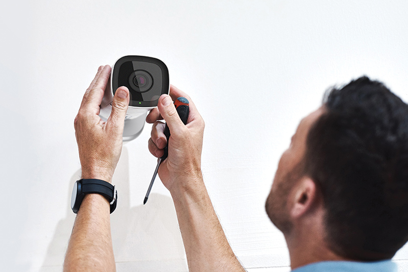 Close-up shot of the Eufy SoloCam L40 being mounted to an exterior wall during the wireless installation process
