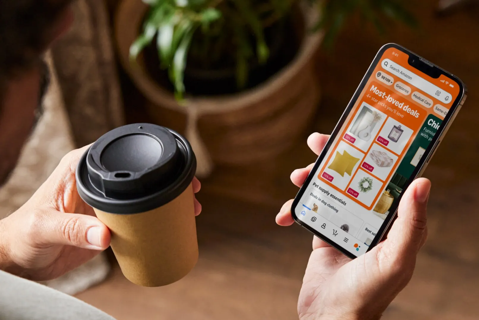  A person's hand holds a smartphone with a deal notification on a shopping app.
